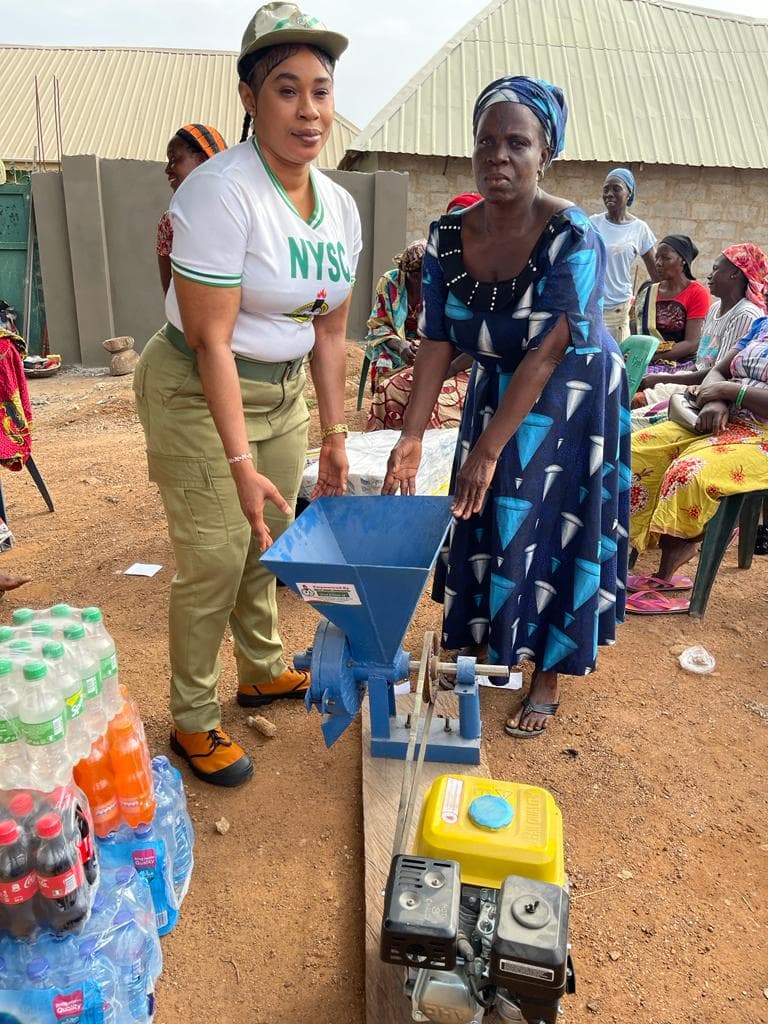 Founder empowering a local business owner with a grinding machine